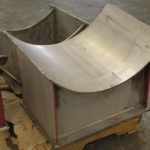 Custom stainless steel pipe saddles during fabrication